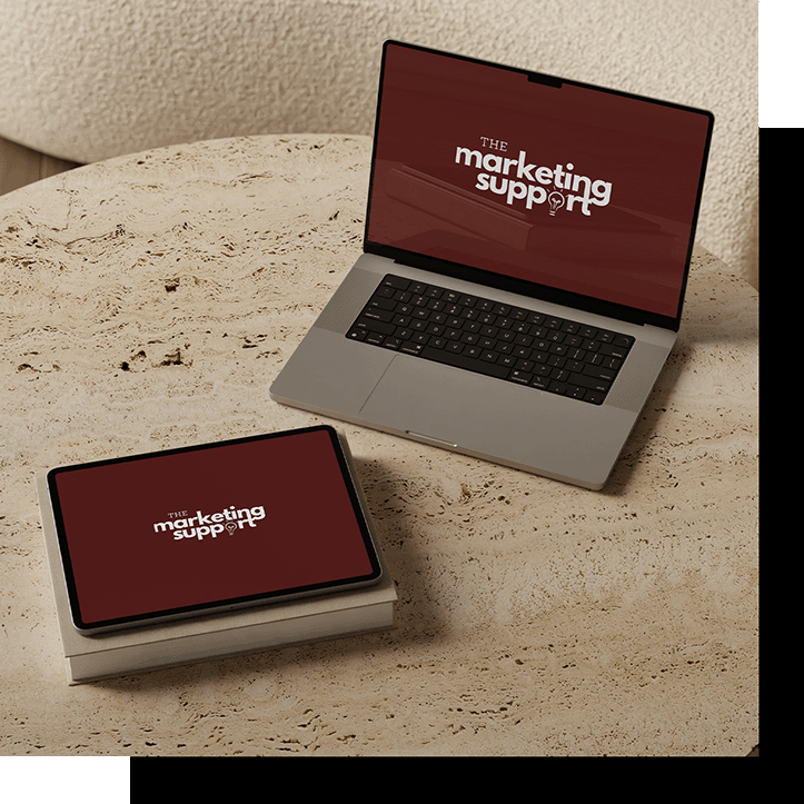 Jeni Assandey working on laptop with marketing strategy documents - Fractional CMO services Copenhagen Denmark